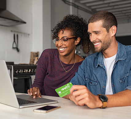 Couple sitting at laptop use Visa Cash Back Card U Earn Rewards