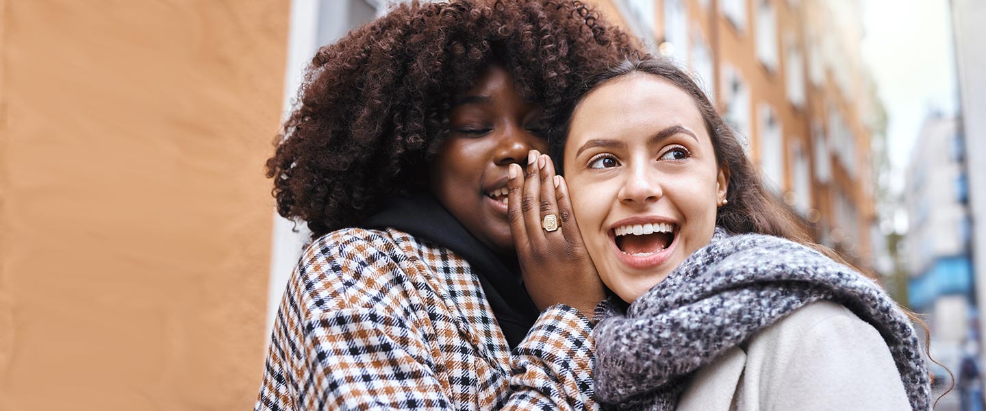 APGFCU Refer A Friend Girls talking to each other