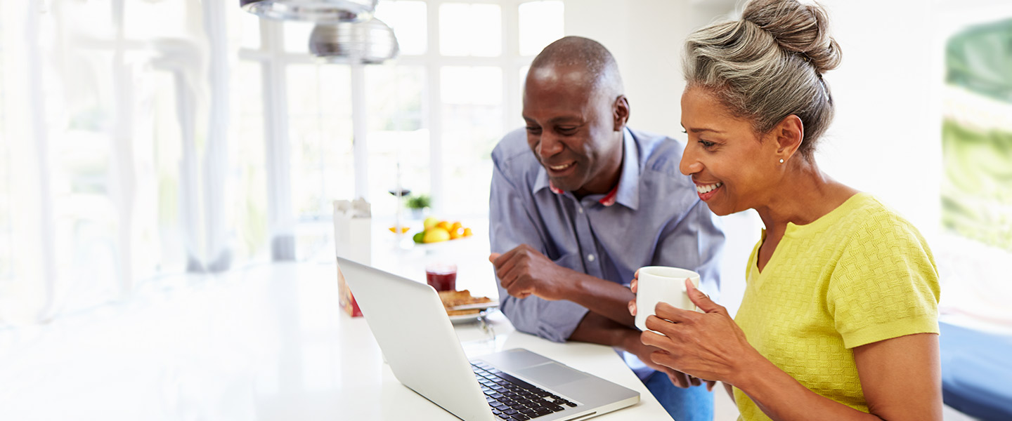 Couple looking at APGFCU Benefit Programs